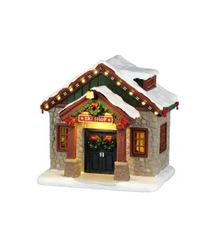Lemax Ski Shop 64681: negozio di articoli da sci illuminato con facciata in pietra