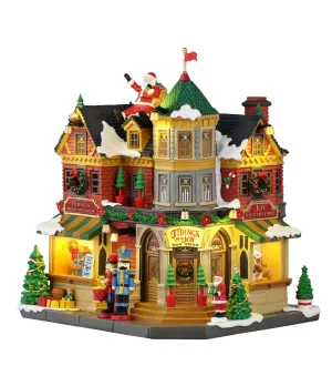 Lemax Tidings and Joy 65526: negozio di giocattoli vittoriano illuminato con Babbo Natale sul tetto